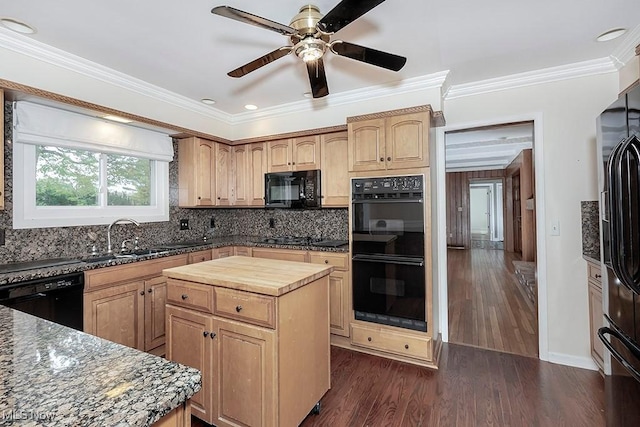 kitchen with black appliances, crown molding, sink, a kitchen island, and dark hardwood / wood-style flooring