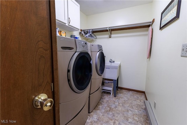 laundry room featuring cabinets and independent washer and dryer