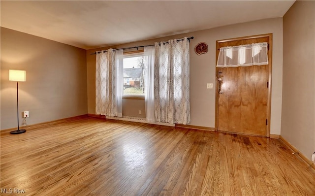 spare room featuring light hardwood / wood-style flooring