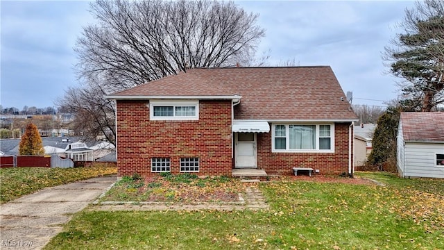 bungalow-style home featuring a front yard