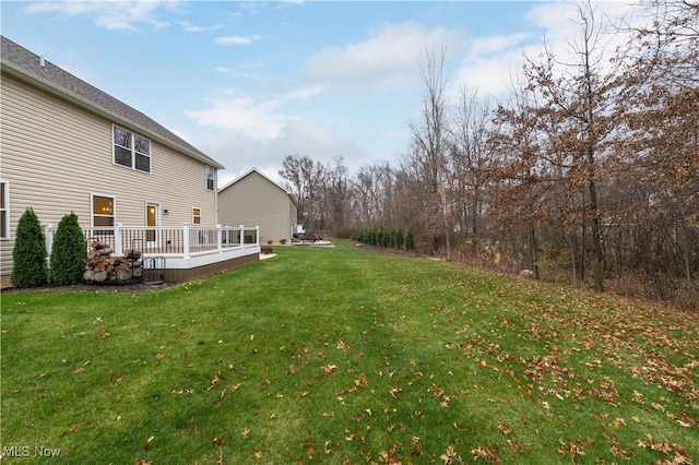 view of yard featuring a wooden deck