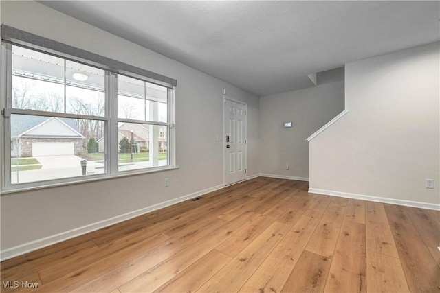 entrance foyer featuring light hardwood / wood-style floors