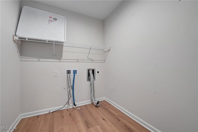 laundry room with hookup for an electric dryer, washer hookup, and wood-type flooring