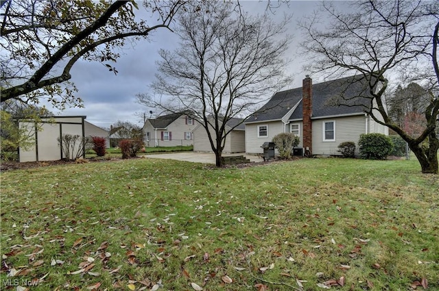 view of yard with a patio area and central AC