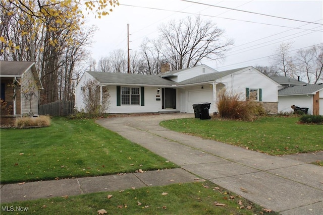 single story home with a front yard and a garage