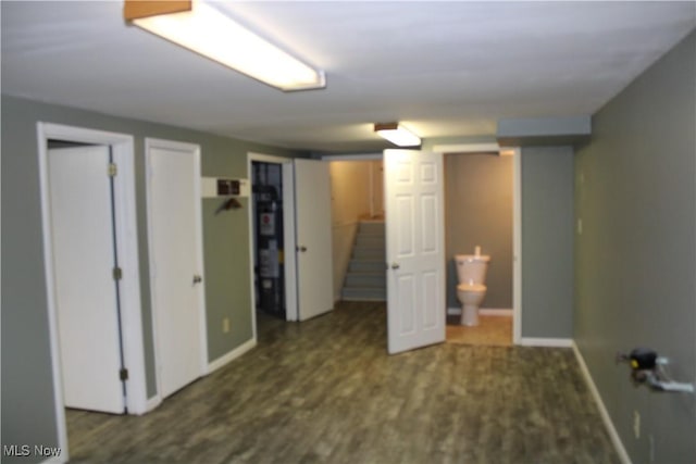 interior space featuring dark hardwood / wood-style flooring and connected bathroom