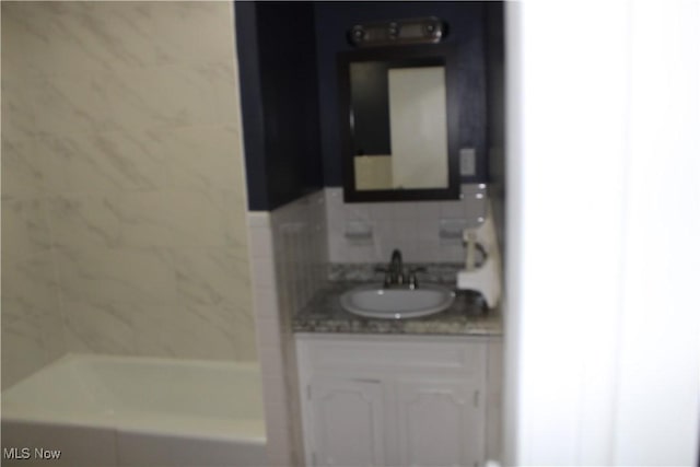 bathroom featuring a bathtub and vanity