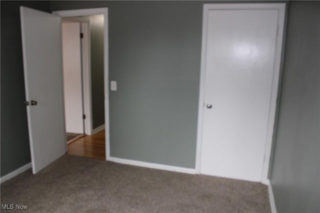 unfurnished bedroom with carpet floors