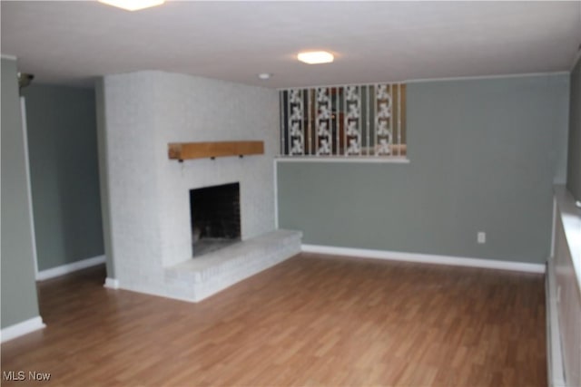 unfurnished living room featuring wood-type flooring