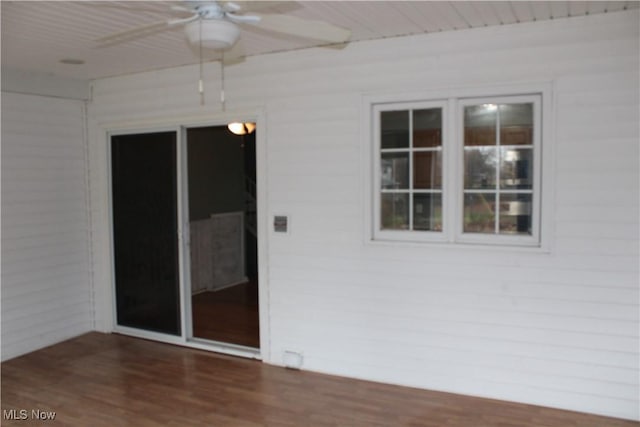 spare room with ceiling fan and dark hardwood / wood-style flooring