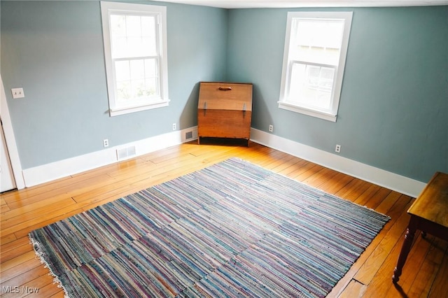 unfurnished room with light hardwood / wood-style floors