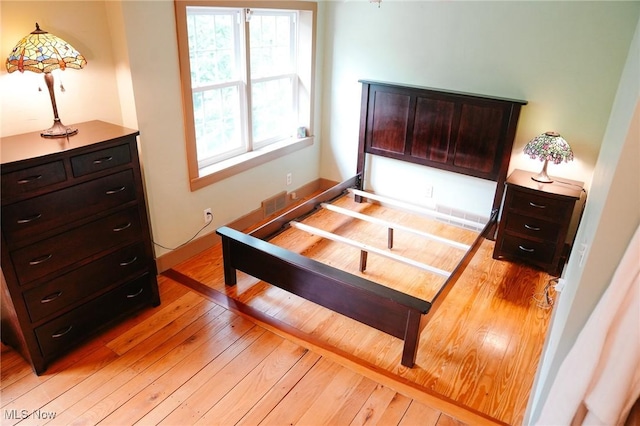 bedroom with light hardwood / wood-style floors