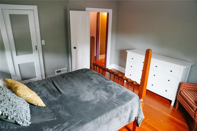 bedroom featuring hardwood / wood-style floors