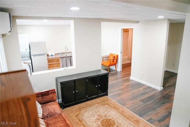 4101 Canfield Rd, Canfield, OH 44406 - kitchen with freestanding refrigerator, dark cabinets, wood finished floors, recessed lighting, and light countertops