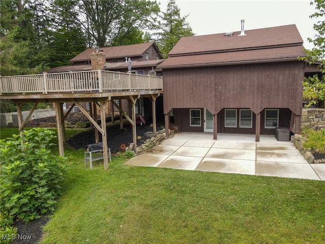 4101 Canfield Rd, Canfield, OH 44406 - back of property featuring a patio, a deck, a lawn, and roof with shingles