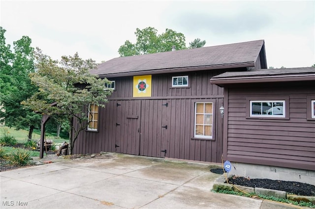 view of side of property with a patio area