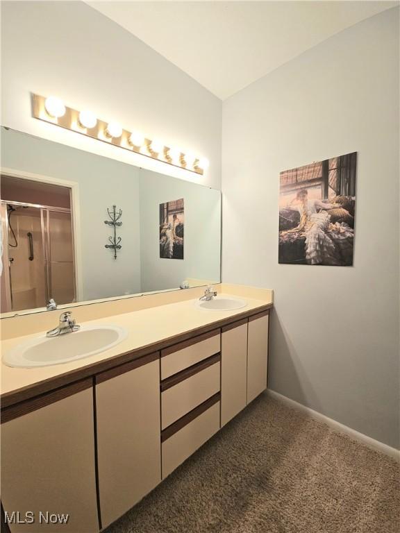 bathroom with vanity and walk in shower