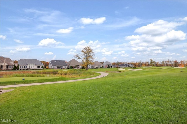 view of home's community featuring a yard