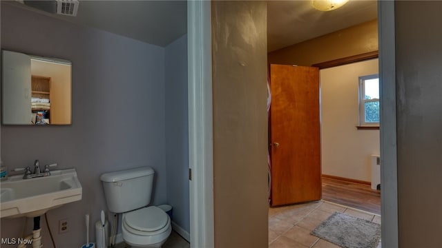 bathroom featuring tile patterned floors, sink, and toilet