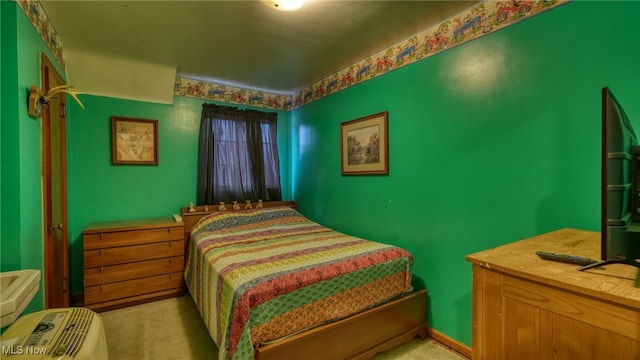 bedroom featuring light carpet