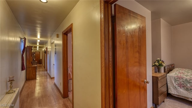 corridor featuring light hardwood / wood-style flooring