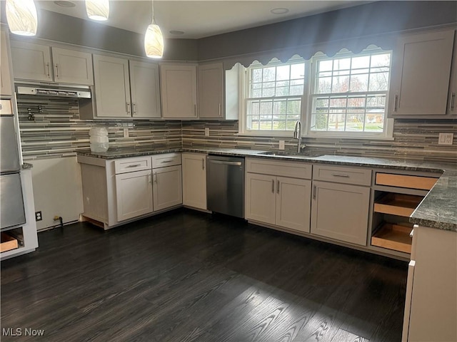 kitchen with tasteful backsplash, dark wood-type flooring, sink, pendant lighting, and dishwasher