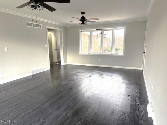 empty room with ornamental molding, ceiling fan, and dark wood-type flooring