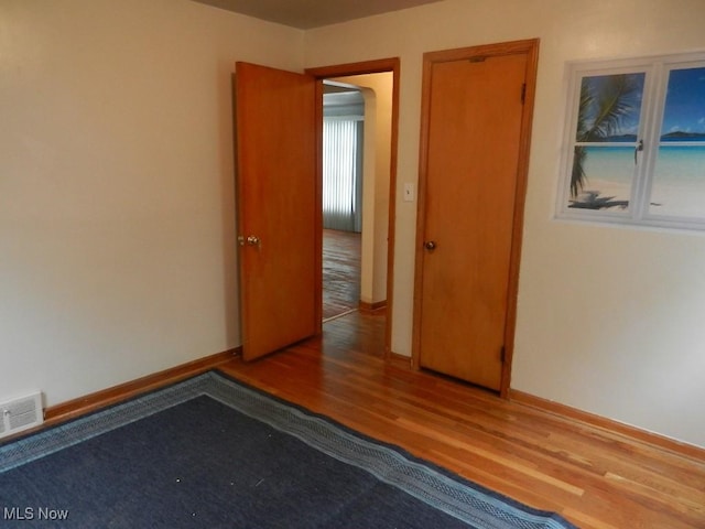 spare room featuring hardwood / wood-style floors