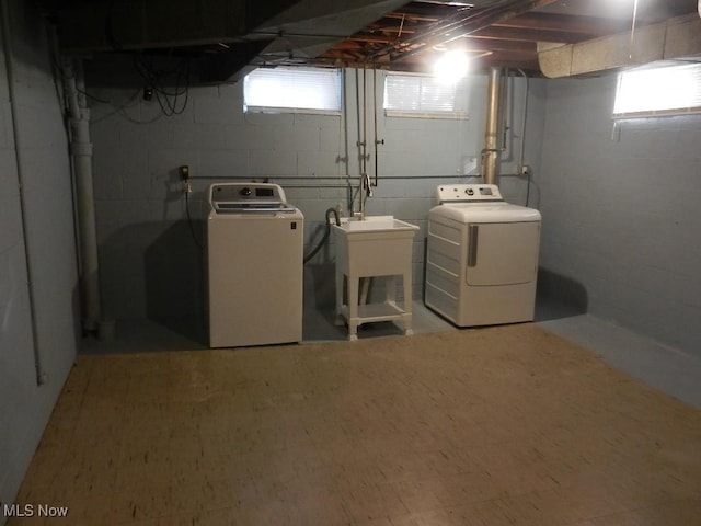 washroom with washing machine and clothes dryer