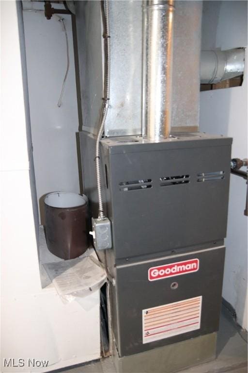 utility room featuring heating unit