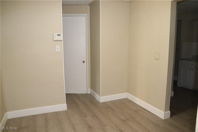 hallway featuring light hardwood / wood-style flooring