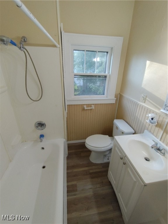 full bathroom featuring wood-type flooring, vanity, toilet, and shower / washtub combination