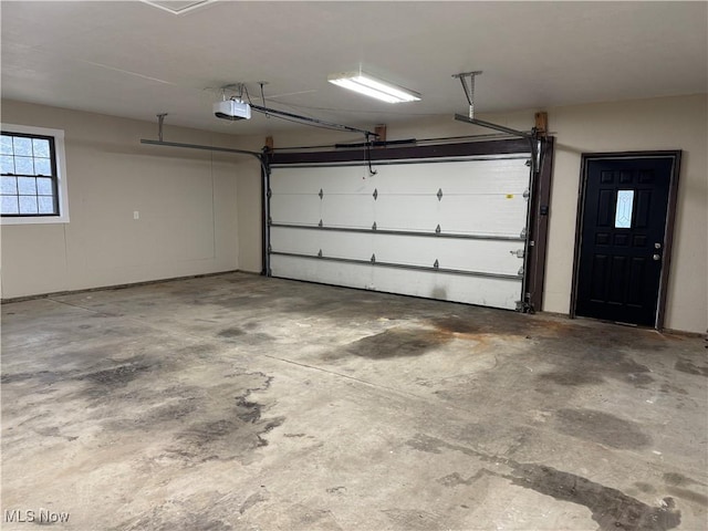 garage featuring a garage door opener