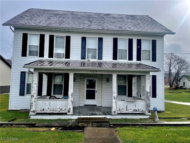 view of front of home with a front lawn and covered porch