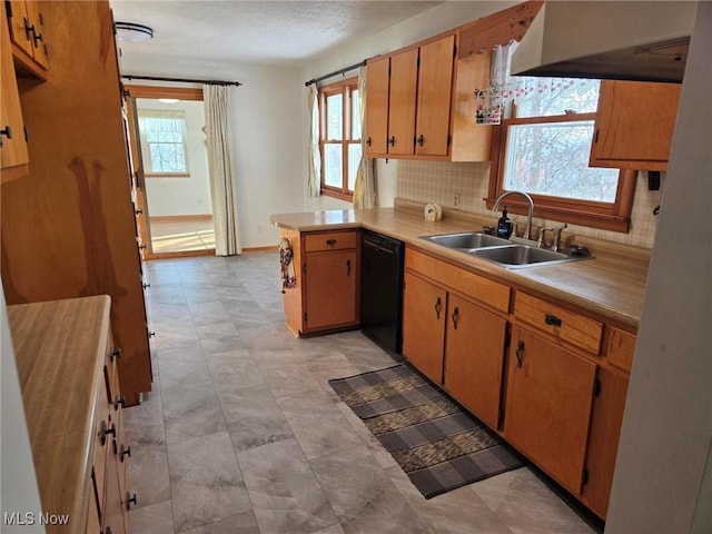 kitchen with range hood, black dishwasher, sink, decorative backsplash, and kitchen peninsula