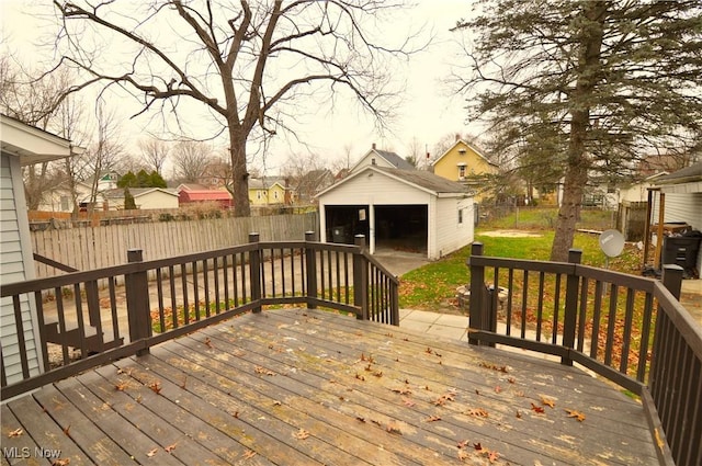 deck featuring an outbuilding and a garage