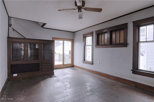 spare room featuring ceiling fan and a textured ceiling