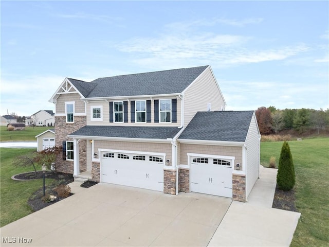 view of front facade featuring a garage and a front yard