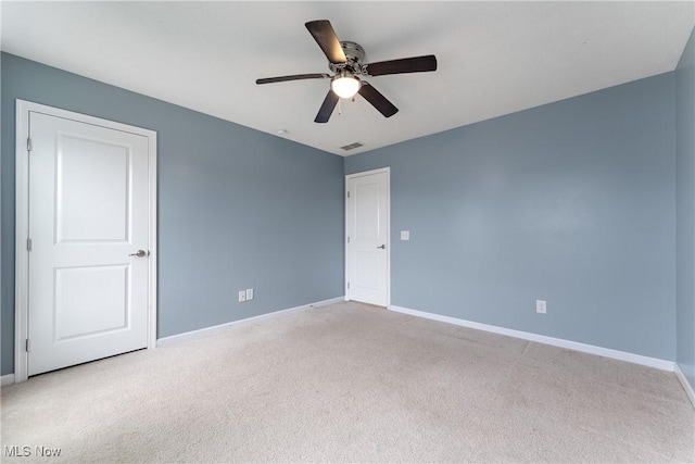 carpeted empty room with ceiling fan