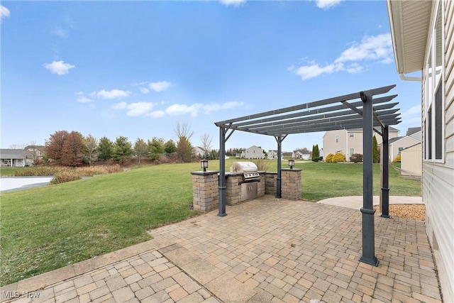 view of patio featuring a pergola, a grill, and exterior kitchen