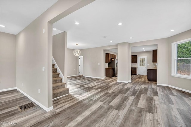 unfurnished living room with hardwood / wood-style flooring