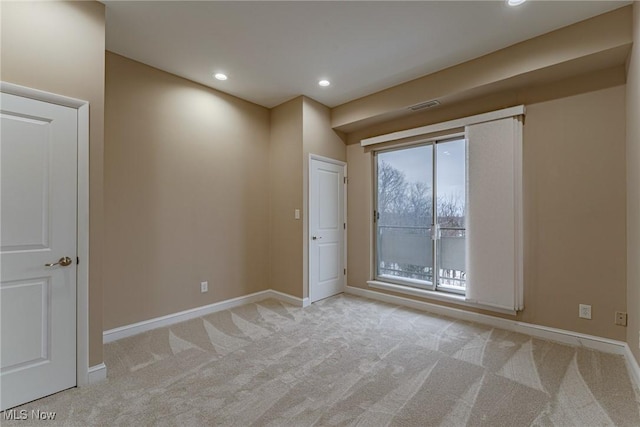 empty room with light colored carpet