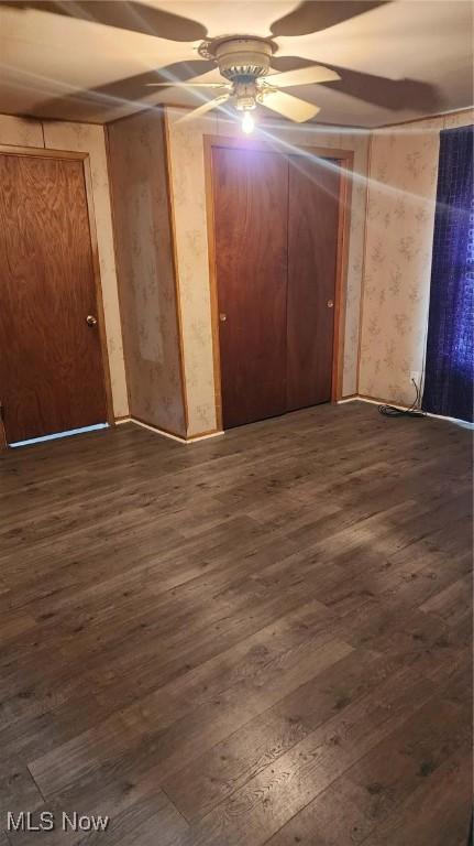 empty room with dark hardwood / wood-style floors