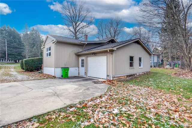 view of side of home with a garage