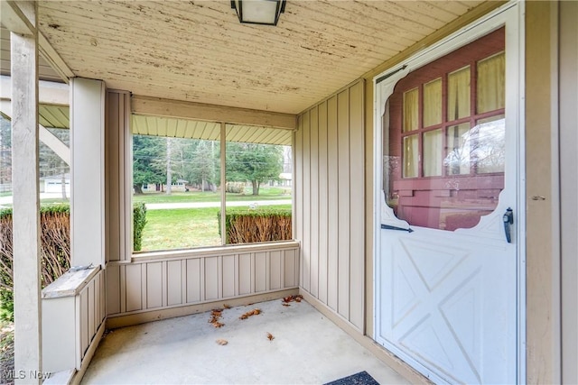 sunroom / solarium featuring wooden ceiling