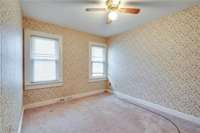 unfurnished room with carpet floors and ceiling fan