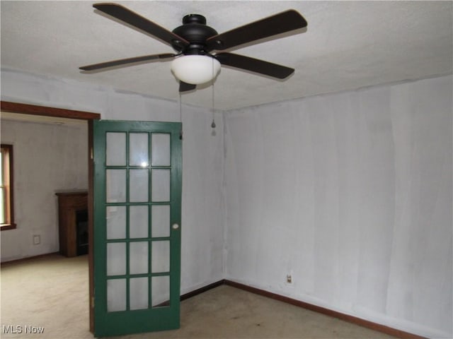 unfurnished room featuring ceiling fan