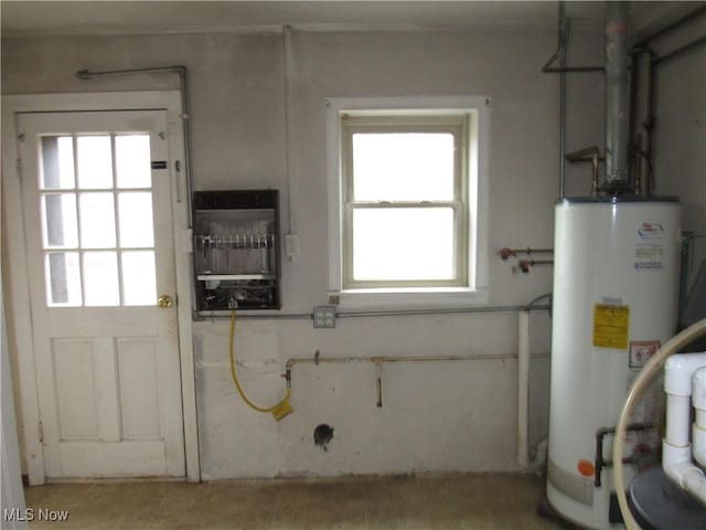 utility room featuring gas water heater