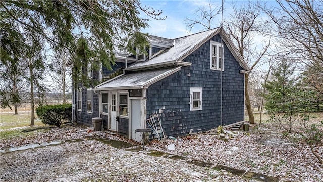 view of home's exterior with a sunroom