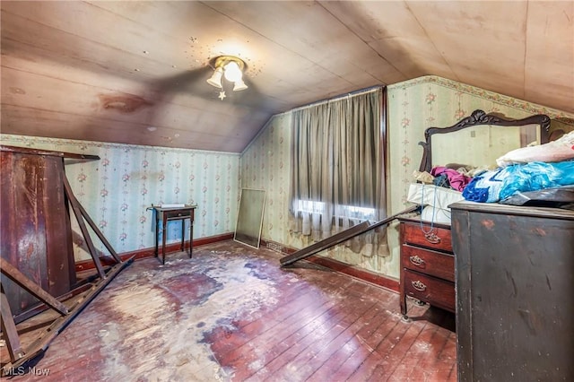 additional living space with wood-type flooring and lofted ceiling